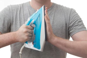 A man touching the sole of an iron on a white background