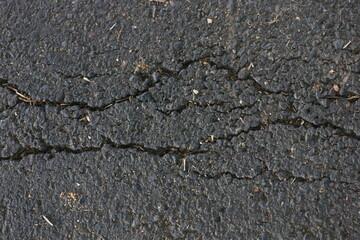 road asphalt texture that breaks due to vehicle vibrations that pass through the load capacity of the asphalt