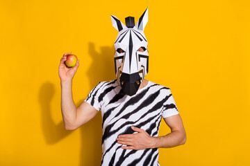 Photo of incognito guy in zebra mask advise eat apple ripe good wellness digestion stomach isolated...