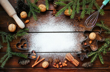 Background of making ginger cookies for Christmas,spruce branches, cinnamon, flour, place for text