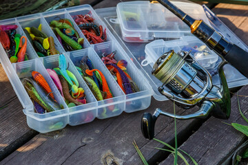 A large fisherman's tackle box fully stocked with lures and gear for fishing.fishing lures and accessories. fishing spinning. Kit of fishing lures.