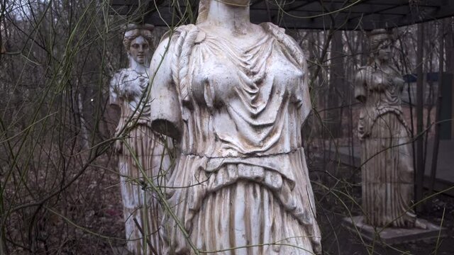 focus on Statue of Caryatides in the Neskuchny Garden by late autumn in Moscow
