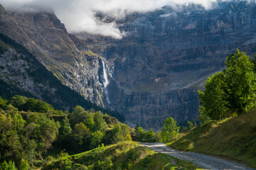 A road leading to the Gavarnie Circus in French Pyrenees - obrazy, fototapety, plakaty