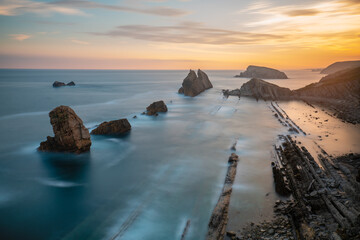 Fototapeta na wymiar Incredible cliffs on the Spanish coast near Santander during a beautiful sunrise.