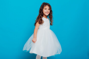 little girl 5 years old in a white princess dress