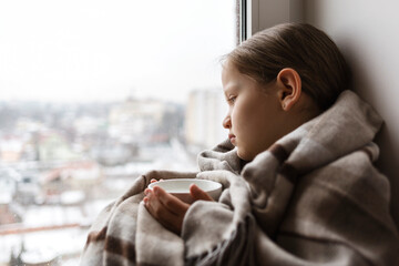 Winter depression sad girl with Seasonal affective disorder girl grief stricken alone at home...