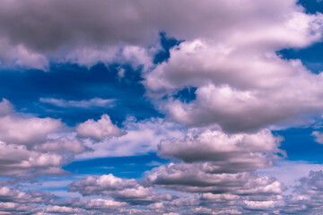 Cloudy sky with large white fluffy air clouds