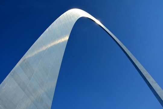 looking up at the arch  in gateway arch national park on a sunny day on the riverfront in st. louis, missouri 