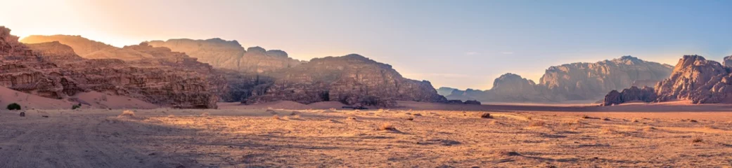 Foto op Canvas Panorama landscape shot of Wadi Rum desert in Jordan during golden hour © Kristof