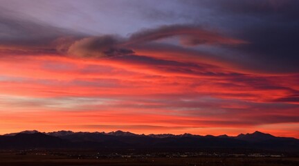 colorful  sunset over long's peak and the front range of the colorado rocky mountains, as seen from broomfield,colorado