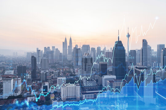 Glowing FOREX graph hologram, aerial panoramic cityscape of Kuala Lumpur at sunset. Stock and bond trading in KL, Malaysia, Asia. The concept of fund management. Double exposure. - Powered by Adobe
