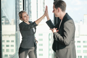 Two businessman and businesswoman couple meeting in co working space or office