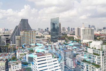 Technology hologram over panorama city view of Bangkok. The largest tech hub in Southeast Asia. The concept of developing coding and high-tech science. Double exposure.