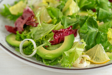 Close up of healthy green salad. Vegetarian food.