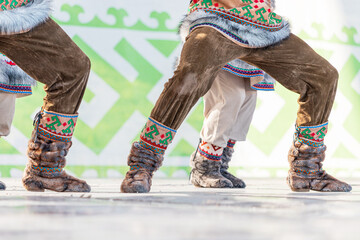 Traditional warm shoes of the indigenous peoples of the north. Boots richly decorated with deer fur...