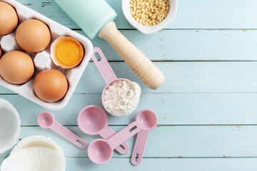 Baking concept with ingredients on blue