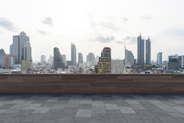 Fototapeta na wymiar Panoramic Bangkok skyline view, concrete observatory deck on rooftop, daytime. Luxury Asian corporate and residential lifestyle. Financial city downtown, real estate. Product display mockup empty roof