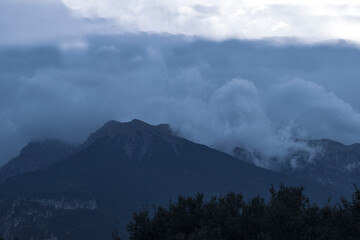 Evening Mountain Parnassus is shrouded in fluffy clouds in the distance