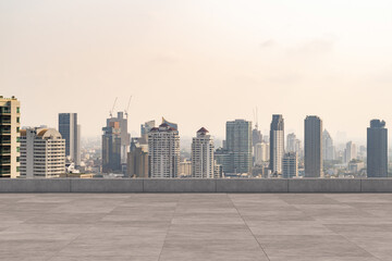 Fototapeta premium Panoramic Bangkok skyline view, concrete observatory deck on rooftop, daytime. Luxury Asian corporate and residential lifestyle. Financial city downtown, real estate. Product display mockup empty roof