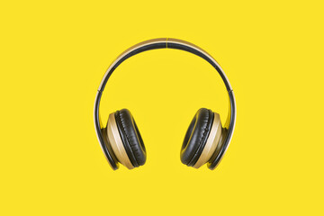 Fototapeta na wymiar A wireless headphone in a yellow background