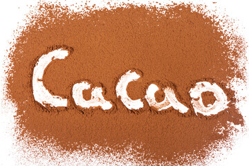Top view of engraved letters on cocoa powder surface on a white background