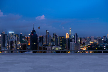 Panoramic Kuala Lumpur skyline view, concrete observatory deck on rooftop, night. Asian corporate and residential lifestyle. Financial city downtown, real estate. Product display mockup empty roof