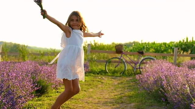 A child in a lavender field. Selective focus.