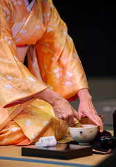 Japanese woman in traditional kimono, during the tea ceremony, at Japanese Festival 2021..
