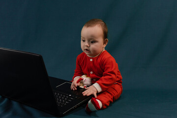 Full length photo of positive interested kid sit legs crossed folded work her laptop read social media news wear casual style clothing isolated over green color background