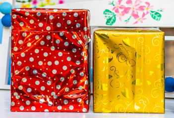 Red and yellow Christmas ornaments gift boxes. Xmas decorations are used to decorate the celebration.