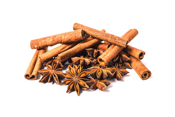 Cinnamon sticks and star anise spice isolated on white background closeup.