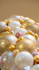 Christmas celebration concept. Bottom view close up photo of beautifully decorated yellow and white baubles and isolated on gold background with copyspace