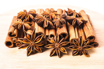 Cinnamon sticks and star anise spice isolated on white background closeup.