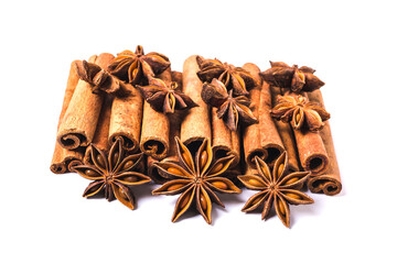 Cinnamon sticks and star anise spice isolated on white background closeup.