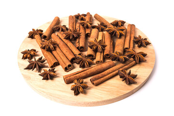 Cinnamon sticks and star anise spice isolated on white background closeup.