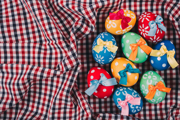 Perfect colorful handmade easter eggs on a fabric background