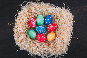 Perfect colorful handmade easter eggs in the nest