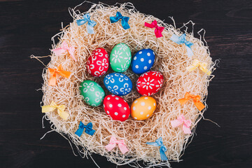 Perfect colorful handmade easter eggs in the nest