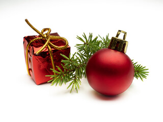 Fototapeta na wymiar Christmas ornament and gift on a pine branch