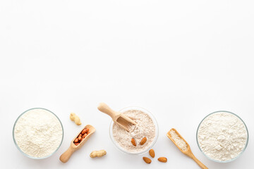 Various types of gluten free flour - almond peanut oat rice flour in bowls