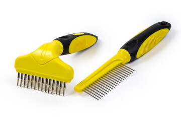 Two different plastic combs for pets with round metal teeth