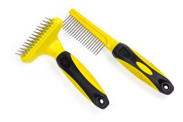 Two different plastic combs for pets with round metal teeth