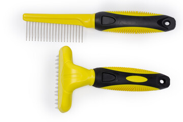 Two different plastic combs for pets with round metal teeth