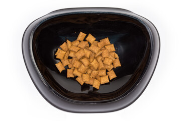 Top view of bowl for cats with dry cat food