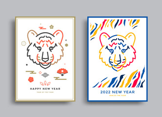 Naklejka na ściany i meble Happy New year 2022 posters with tiger face. The year of the tiger. Japanese new year invites. Vector