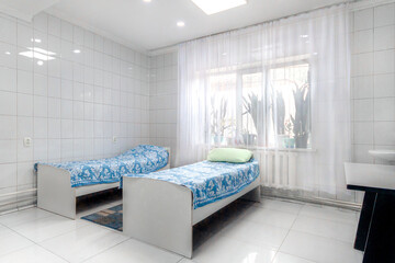 Sanatorium, hospital or clinic white chamber with two bed. CIS location - obrazy, fototapety, plakaty