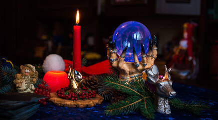 Winter Christmas prediction on a Candle and Tarot cards. Magical esoteric concept. Astrology and wicca rituals