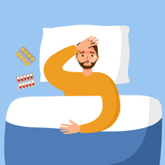 Man suffering from flu in bed under blanket. Guy has fever and take thermometer in mouth with medicine on bed. Flu or cold allergy symptom.
