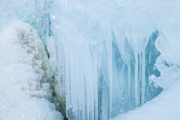 Winter background made of ice, icicles, frozen water drops