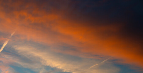 Colorful sunset background with dark and light parts in sky